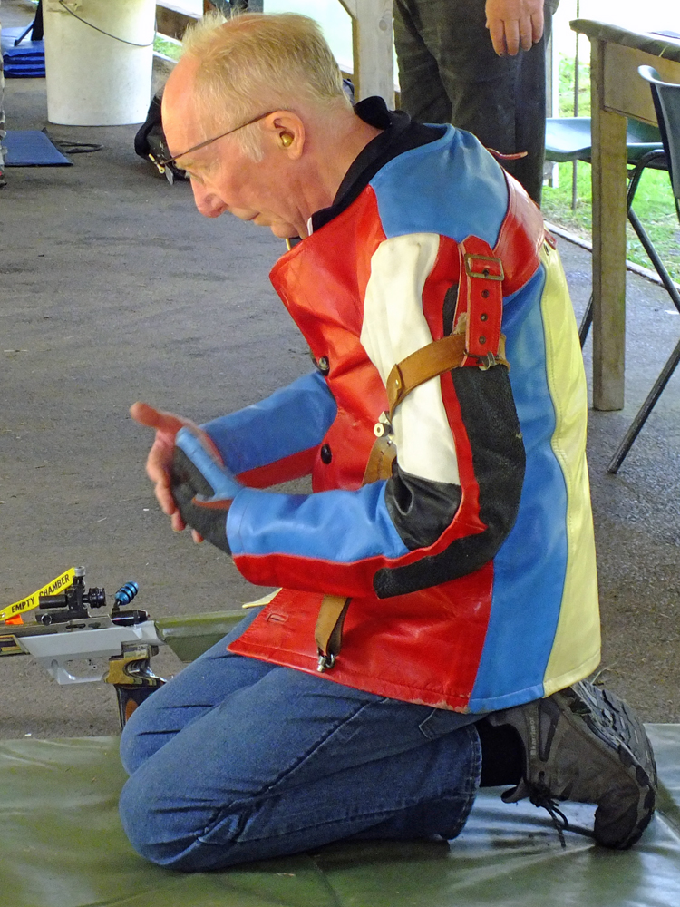 Photograph shows Steve Rowe on the firing line, quietly preparing for another session of marksmanship.